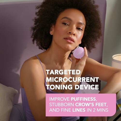 Person using a targeted microcurrent toning device on their face.