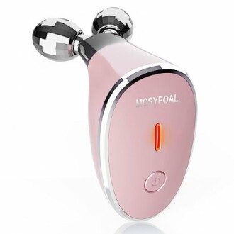 Pink facial massager device with two spherical rollers.